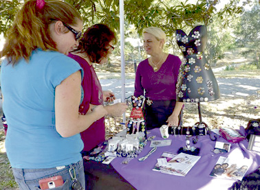 W - Jessica Huff greets guests as they come to look at her crafts