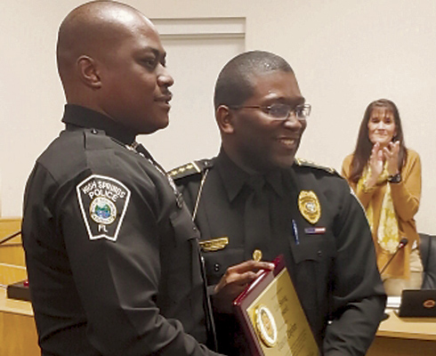 L-R: School Resource Officer Jason Taylor displays his Commendation standing next to High Springs Police Chief Antoine Sheppard.
