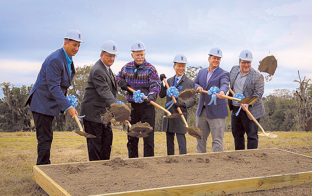 L-R: Alachua Chamber President Mitch Glaeser, architect Paul Stresing, Alachua Mayor Gib Coerper, Tower Hill CEO Kirk La, Scherer Construction President Erik Otte, and CHW President Robert Walpole turn the dirt marking the official start of construction of Tower Hill’s new headquarters building.