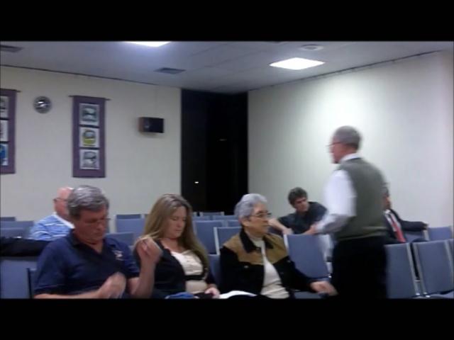 Ron Langman returns to his seat the Jan. 24 special commission meeting.